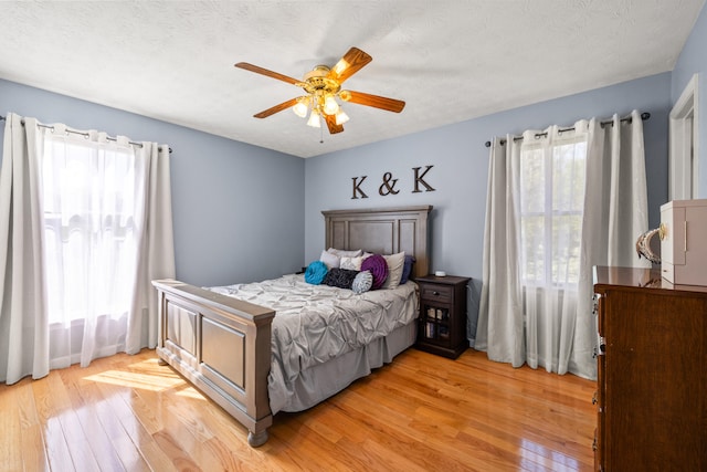 bedroom featuring ceiling fan and light wood finished floors