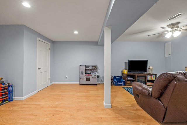 living area with recessed lighting, a ceiling fan, visible vents, and light wood-style floors
