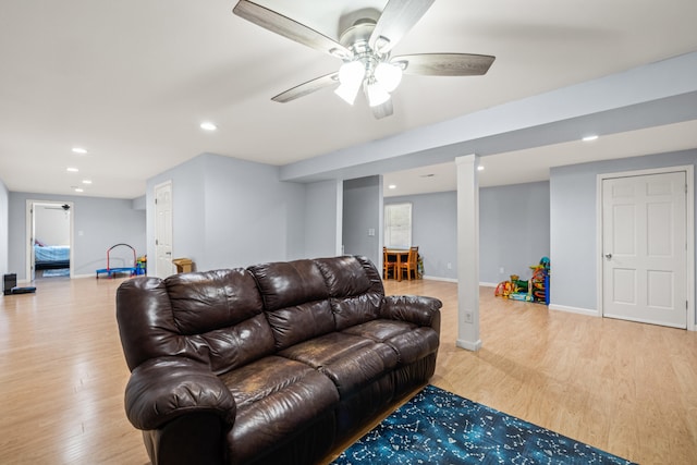 living area with baseboards, ceiling fan, light wood-type flooring, and recessed lighting