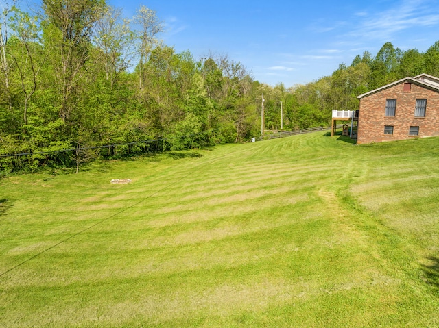 view of yard featuring a view of trees