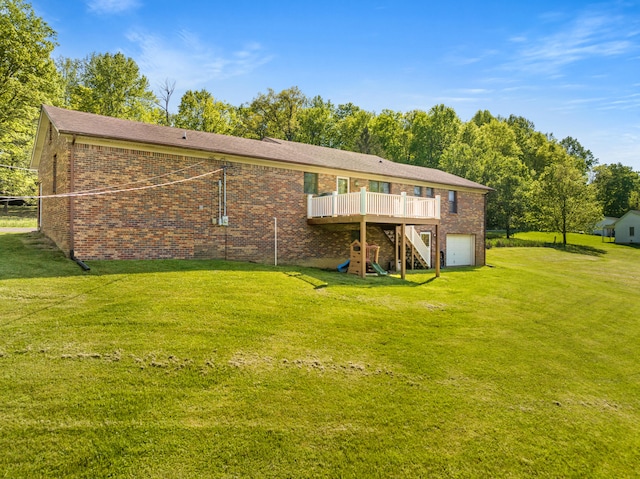 back of property with stairs, brick siding, a garage, a wooden deck, and a yard