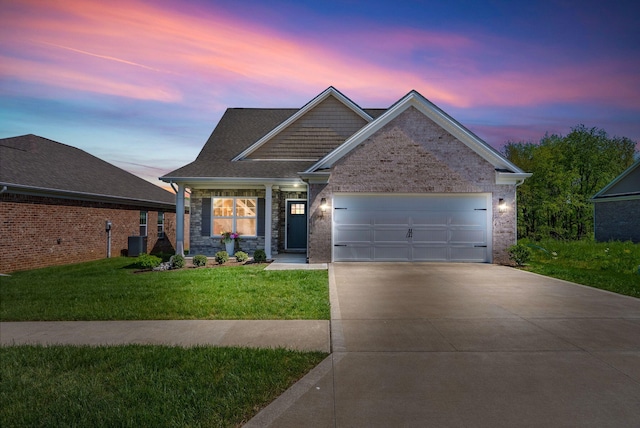 view of front of property with a front lawn, cooling unit, a shingled roof, an attached garage, and driveway