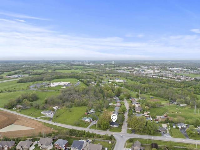 aerial view of property and surrounding area with nearby suburban area