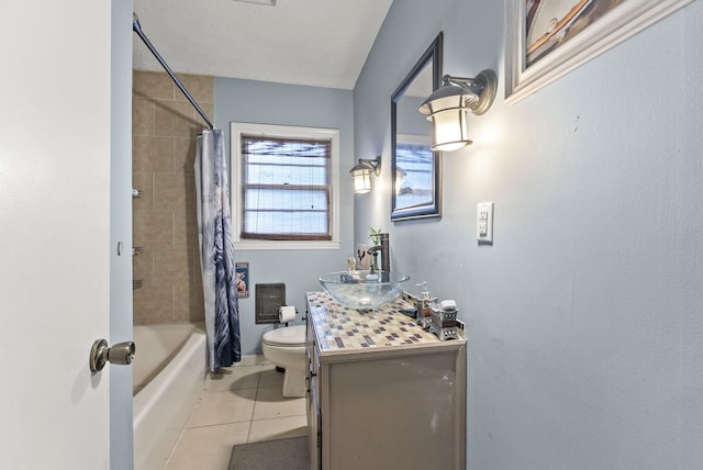 bathroom featuring tile patterned floors, toilet, vanity, and shower / tub combo