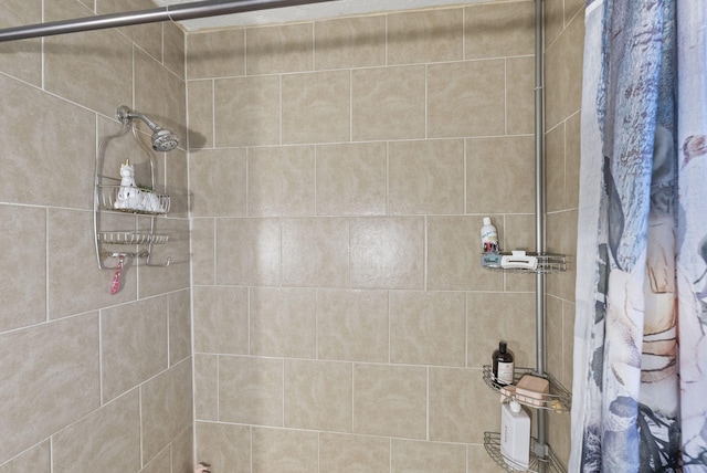 bathroom with a tile shower