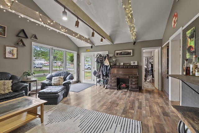 living room with wood-type flooring and high vaulted ceiling