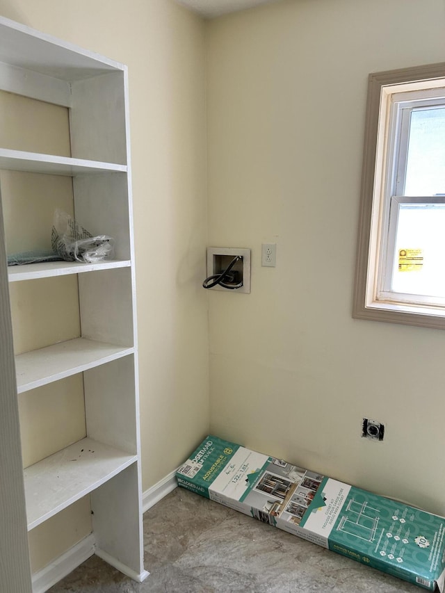 laundry room featuring hookup for an electric dryer, hookup for a washing machine, and baseboards