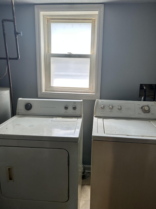 laundry room with independent washer and dryer and laundry area