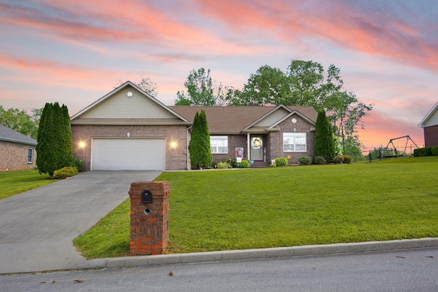 ranch-style house with an attached garage, a yard, driveway, and brick siding