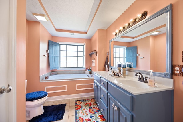 bathroom with toilet, tile patterned flooring, a sink, and a garden tub