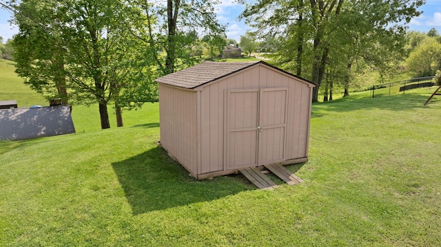 view of shed with fence