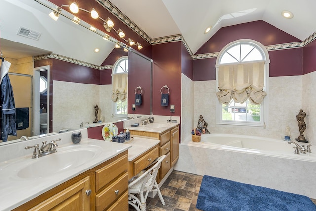 3120 Helmsdale Pl, Lexington, KY 40509 - full bathroom with vaulted ceiling, plenty of natural light, a bath, double vanity, and recessed lighting