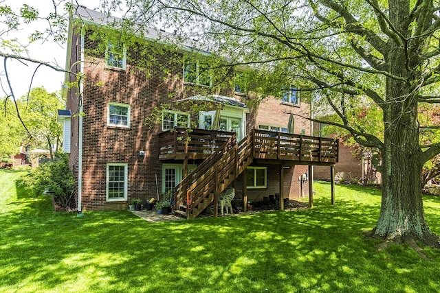 3120 Helmsdale Pl, Lexington, KY 40509 - rear view of property with a deck, brick siding, a lawn, and stairs