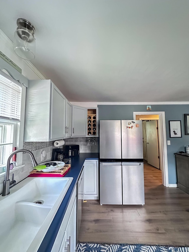 200 Summitt Ave, Somerset, KY 42501 - kitchen featuring dark wood-style flooring, white cabinetry, tasteful backsplash, a sink, and stainless steel appliances