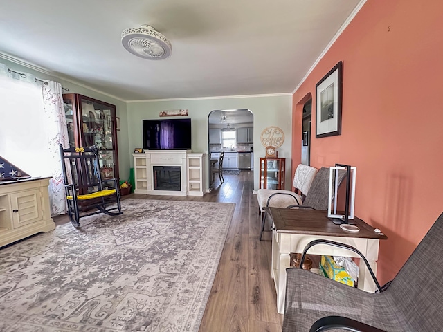 200 Summitt Ave, Somerset, KY 42501 - living room with crown molding, arched walkways, a fireplace, and wood finished floors