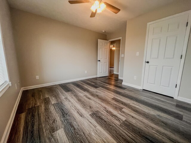 601 Heaton Ford Rd, Science Hill, KY 42553 - unfurnished bedroom with dark wood-type flooring, a ceiling fan, and baseboards