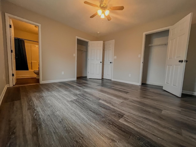 601 Heaton Ford Rd, Science Hill, KY 42553 - unfurnished bedroom featuring a ceiling fan, dark wood finished floors, baseboards, two closets, and ensuite bath