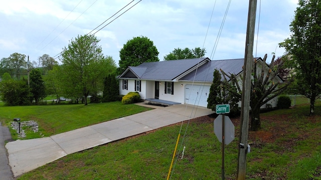 601 Heaton Ford Rd, Science Hill, KY 42553 - single story home featuring concrete driveway, an attached garage, metal roof, and a front yard