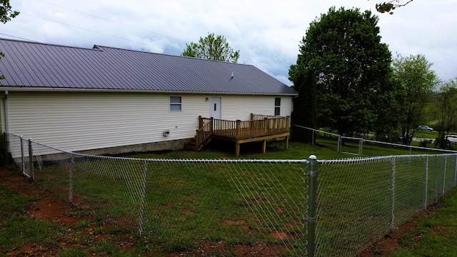 601 Heaton Ford Rd, Science Hill, KY 42553 - rear view of house featuring a lawn, a fenced backyard, a wooden deck, and metal roof