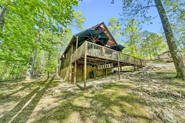 back of house featuring a wooden deck
