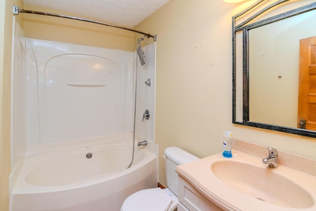 full bath featuring toilet, shower / washtub combination, a textured ceiling, and vanity