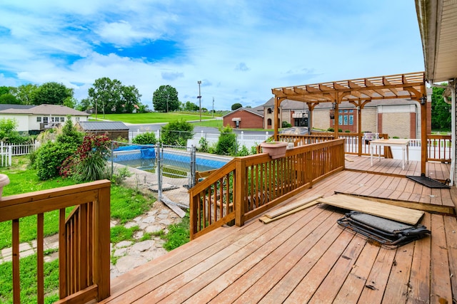 wooden deck with a pergola, a fenced backyard, and a gate