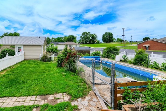view of swimming pool featuring a gate
