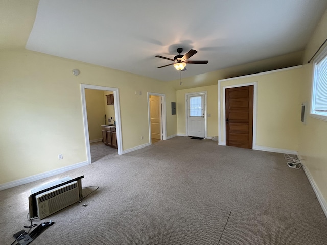245 Cedar Grove Rd, Irvine, KY 40336 - unfurnished bedroom featuring a wall mounted AC, light carpet, multiple windows, and baseboards