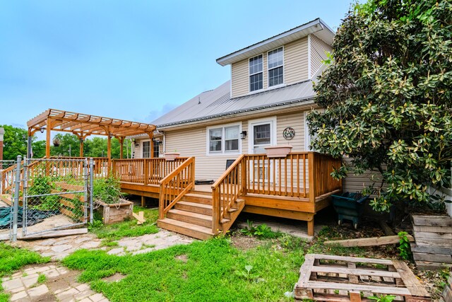 245 Cedar Grove Rd, Irvine, KY 40336 - back of house featuring a garden, a deck, metal roof, and a pergola