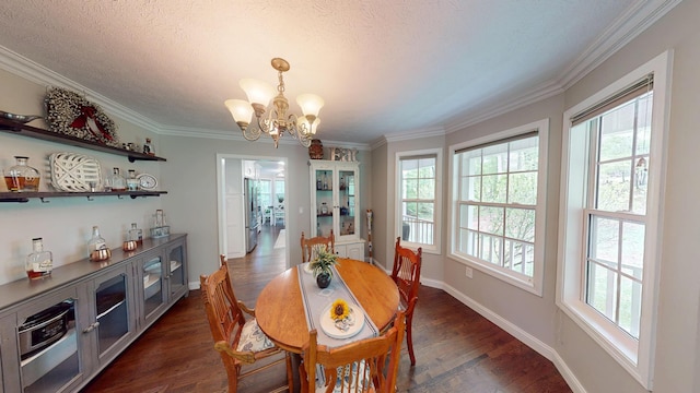 dining area featuring a chandelier, ornamental molding, baseboards, a textured ceiling, and dark wood-type flooring