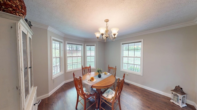dining space featuring wood finished floors, a chandelier, and baseboards