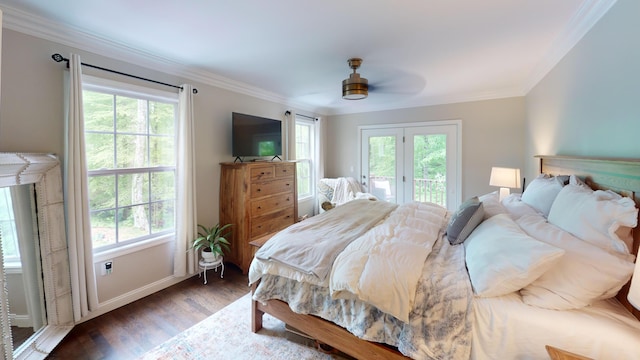 bedroom with wood finished floors, ornamental molding, access to outside, and multiple windows