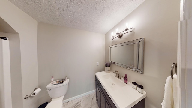 half bath with a textured ceiling, baseboards, toilet, vanity, and marble finish floor