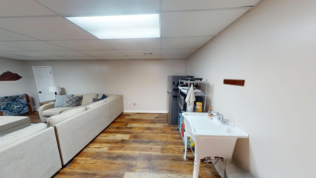 laundry room featuring wood finished floors and baseboards