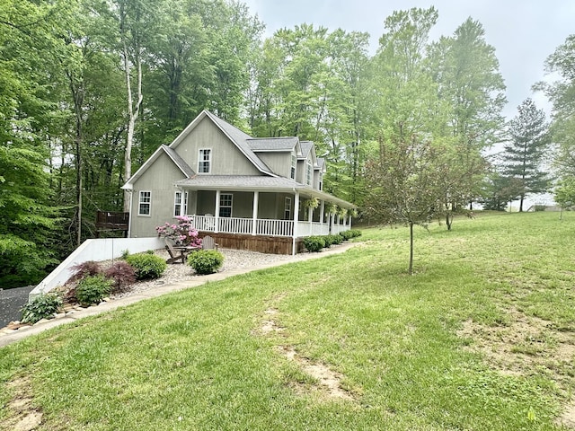 farmhouse featuring a porch and a front lawn