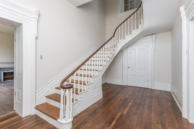 staircase featuring wood-type flooring