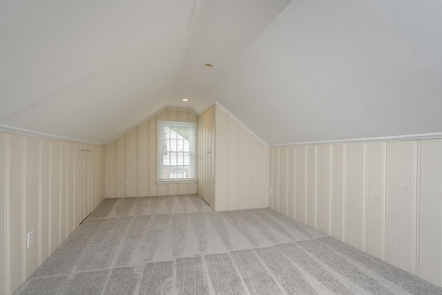 bonus room featuring lofted ceiling and carpet floors