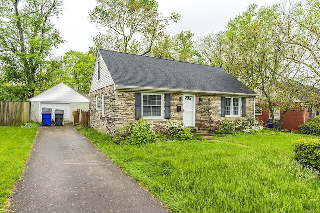 new england style home featuring aphalt driveway, stone siding, a shingled roof, fence, and a garage