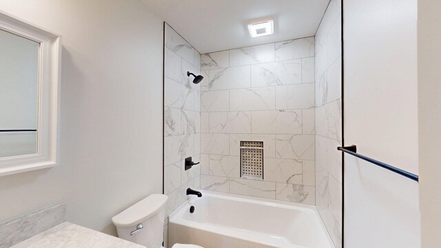 bathroom featuring vanity, bathtub / shower combination, and toilet