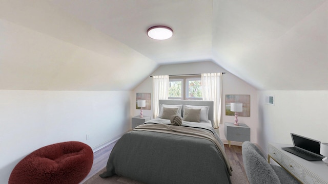 bedroom with baseboards, vaulted ceiling, wood finished floors, and visible vents