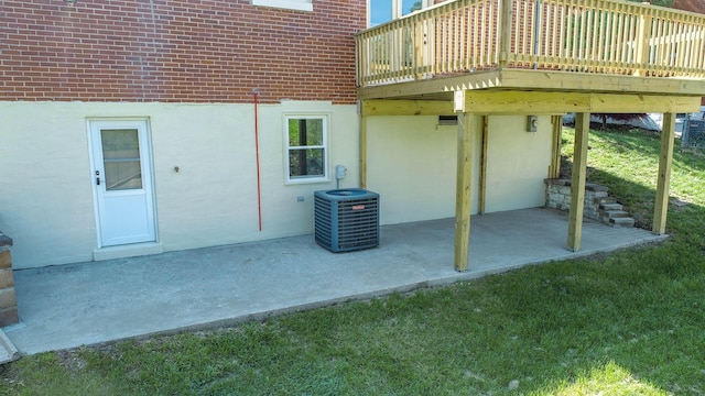 view of patio / terrace with a wooden deck and cooling unit