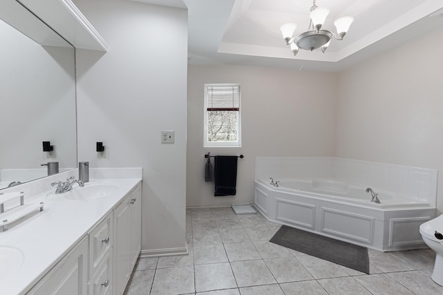 bathroom featuring a sink, double vanity, an inviting chandelier, a garden tub, and tile patterned flooring