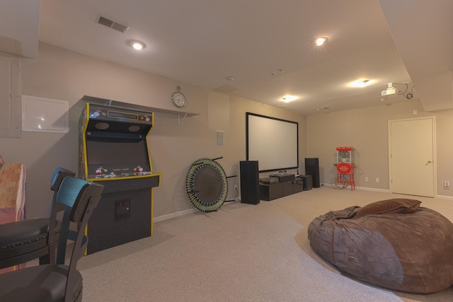 home theater room featuring visible vents, carpet floors, and baseboards