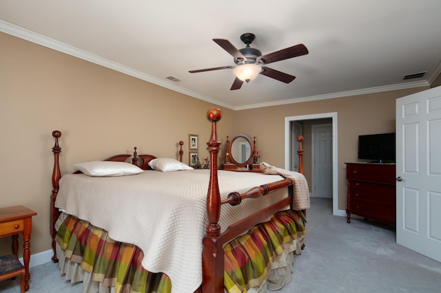 carpeted bedroom featuring crown molding, a ceiling fan, baseboards, and visible vents