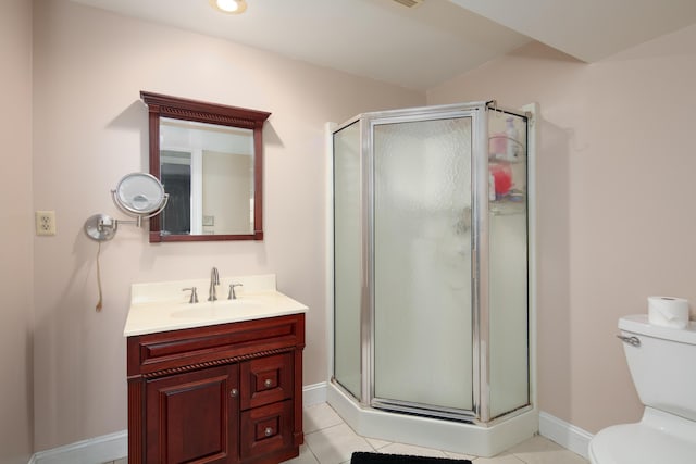 full bath with vanity, tile patterned flooring, a stall shower, and toilet