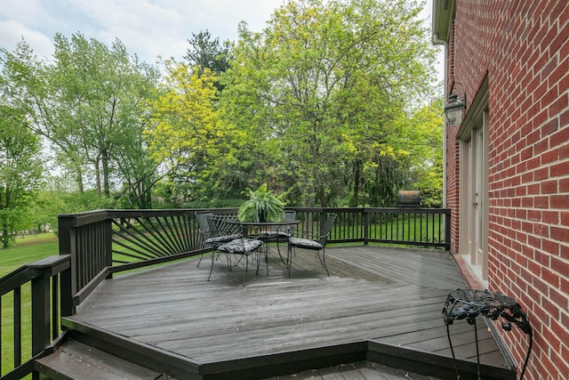 wooden deck with outdoor dining space