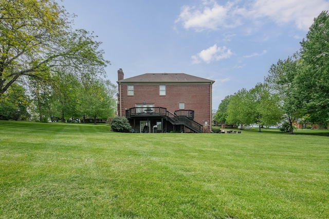 view of yard featuring a wooden deck and stairs