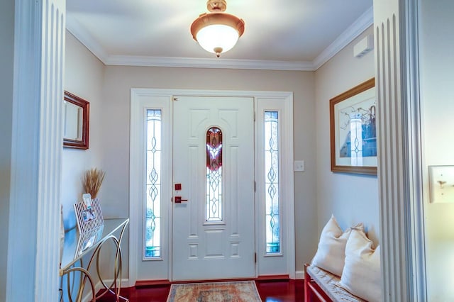 foyer entrance with crown molding, dark wood finished floors, a wealth of natural light, and baseboards