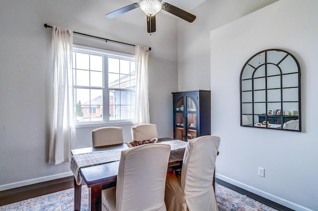 dining area with ceiling fan, wood finished floors, and baseboards