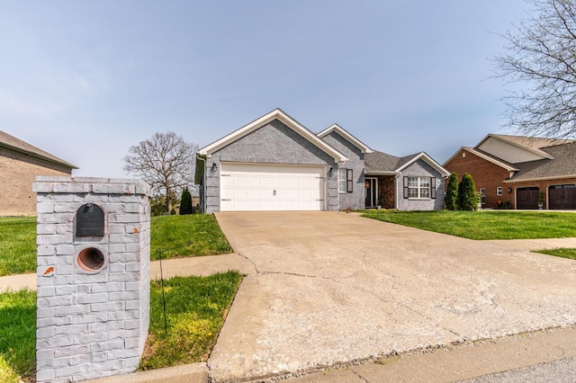 ranch-style house with concrete driveway, a front yard, an attached garage, and brick siding
